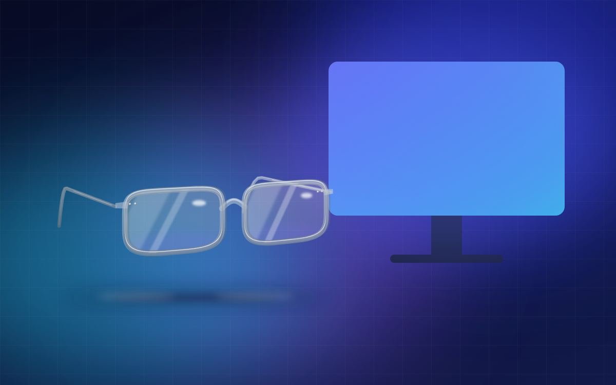 Screen glasses in front of a glowing monitor
